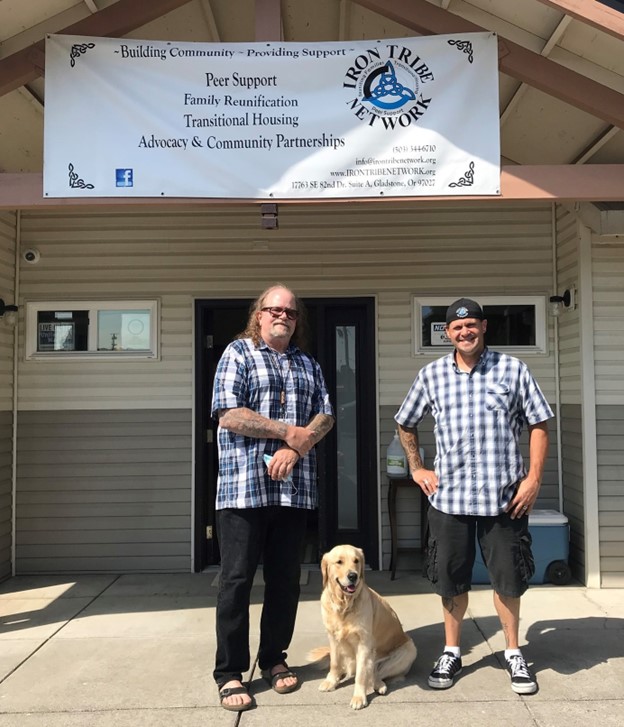 Tony Fleming, Iron Tribe Network Program Director; his dog, Baily; and Shawn Bower, Executive Director, at the entrance to Arnold House